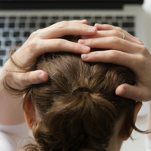 anxious woman with hands on her head