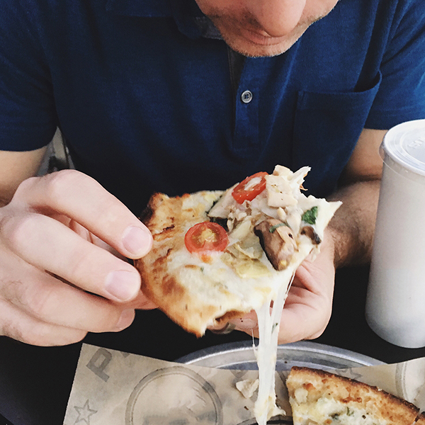 man eating pizza