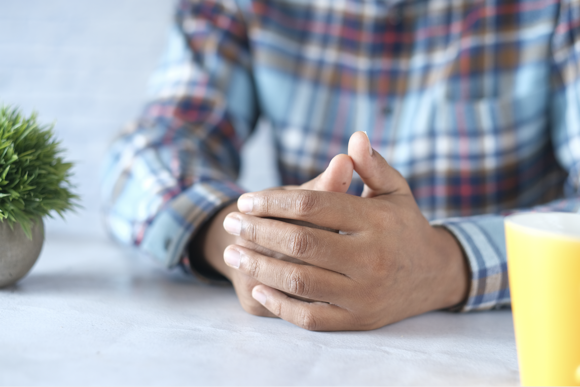 Nervous young man hands