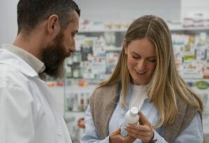 pharmacist consulting a customer on heartburn and acid reflux